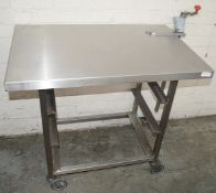 1 x Stainless Steel Commercial Kitchen Table On Castors, With Can Opener And Tray Storage