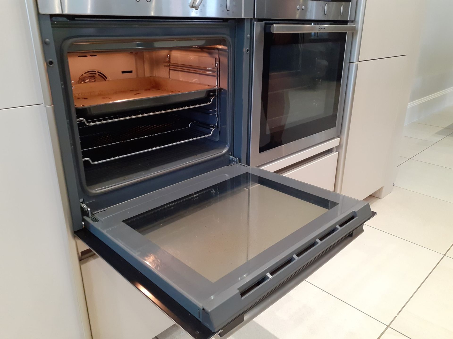 1 x SieMatic Handleless Fitted Kitchen With Intergrated NEFF Appliances, Corian Worktops And Island - Image 32 of 92