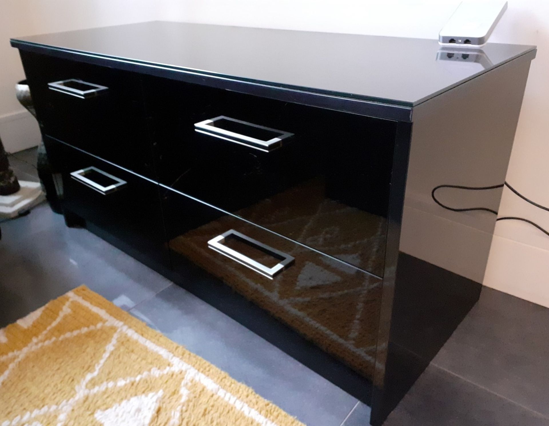 1 x Glass Topped 4-Door TV Unit In A Black Gloss Finish - Dimensions: 121 x 50 x H61cm - NO VAT