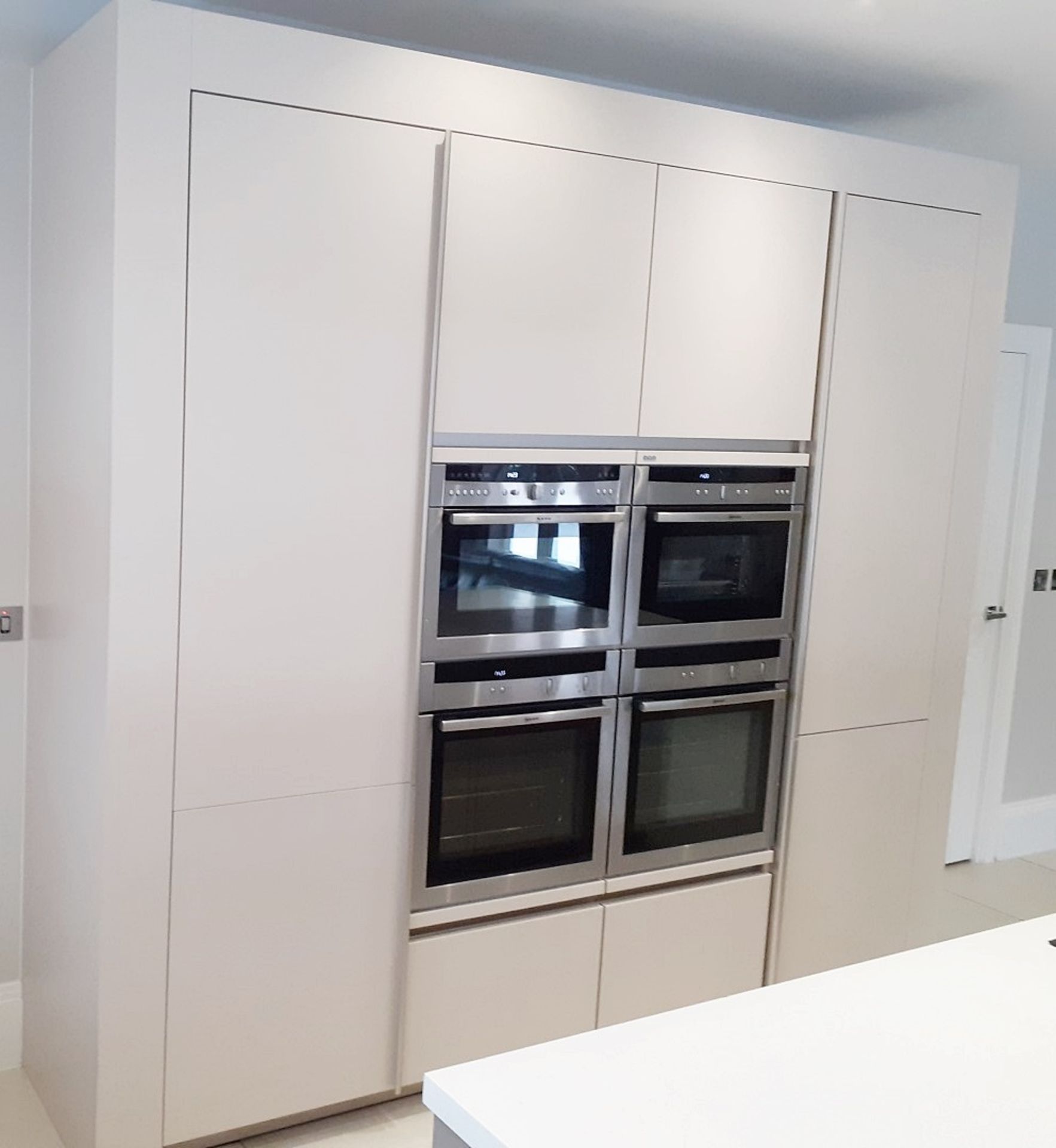 1 x SieMatic Handleless Fitted Kitchen With Intergrated NEFF Appliances, Corian Worktops And Island - Image 13 of 92