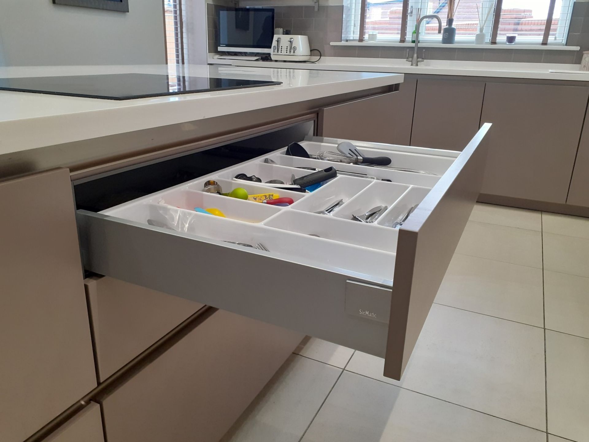 1 x SieMatic Handleless Fitted Kitchen With Intergrated NEFF Appliances, Corian Worktops And Island - Image 52 of 92