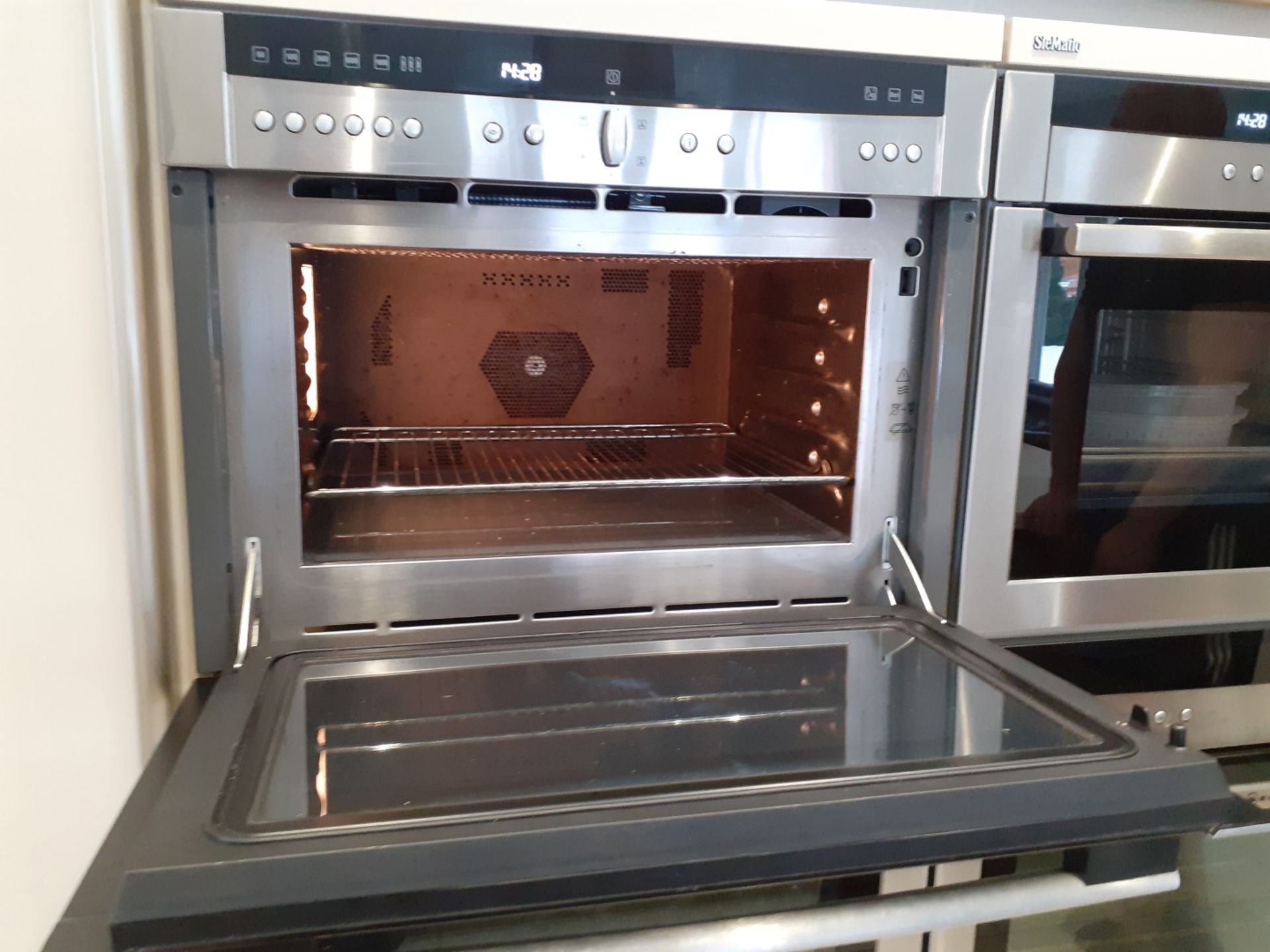 1 x SieMatic Handleless Fitted Kitchen With Intergrated NEFF Appliances, Corian Worktops And Island - Image 29 of 92