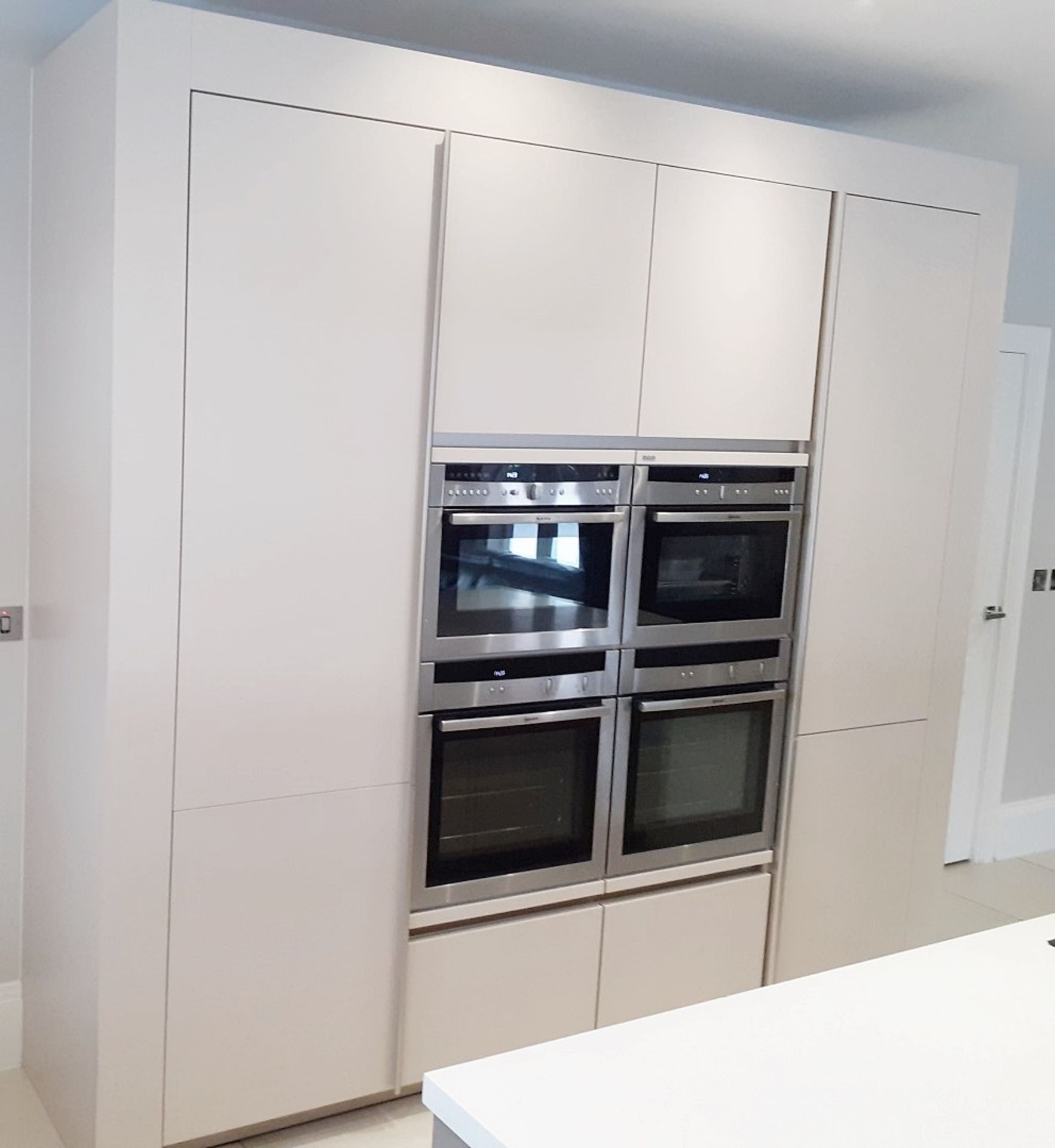 1 x SieMatic Handleless Fitted Kitchen With Intergrated NEFF Appliances, Corian Worktops And Island - Image 62 of 92