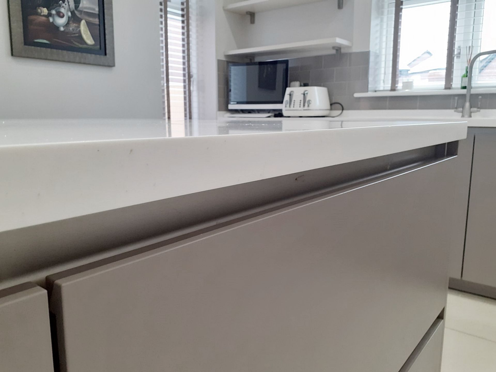 1 x SieMatic Handleless Fitted Kitchen With Intergrated NEFF Appliances, Corian Worktops And Island - Image 69 of 92