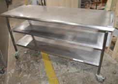 1 x Stainless Steel Commercial Kitchen Mobile Prep Bench With 2 x Undershelves, On Castors -