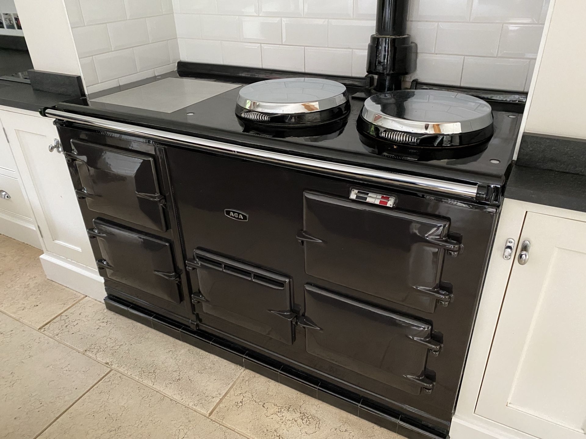 1 x AGA Range Cooker Finished in Black - Features Four Ovens and Two Hot Plates - Recently