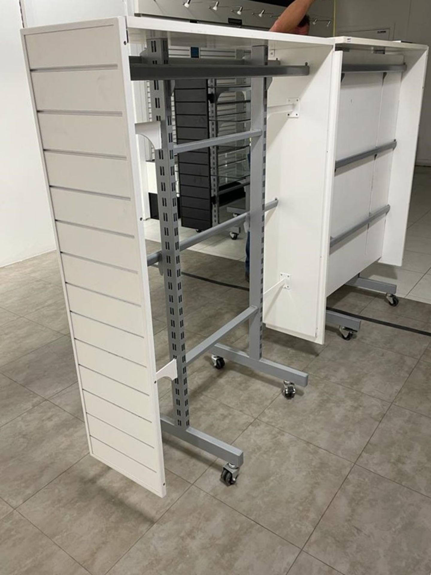 2 x Retail Display Units in White Featuring Clothes Rails, Slat Walls and Castor Wheels - Size - Image 5 of 5
