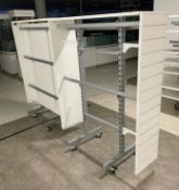 2 x Retail Display Units in White Featuring Clothes Rails, Slat Walls and Castor Wheels - Size