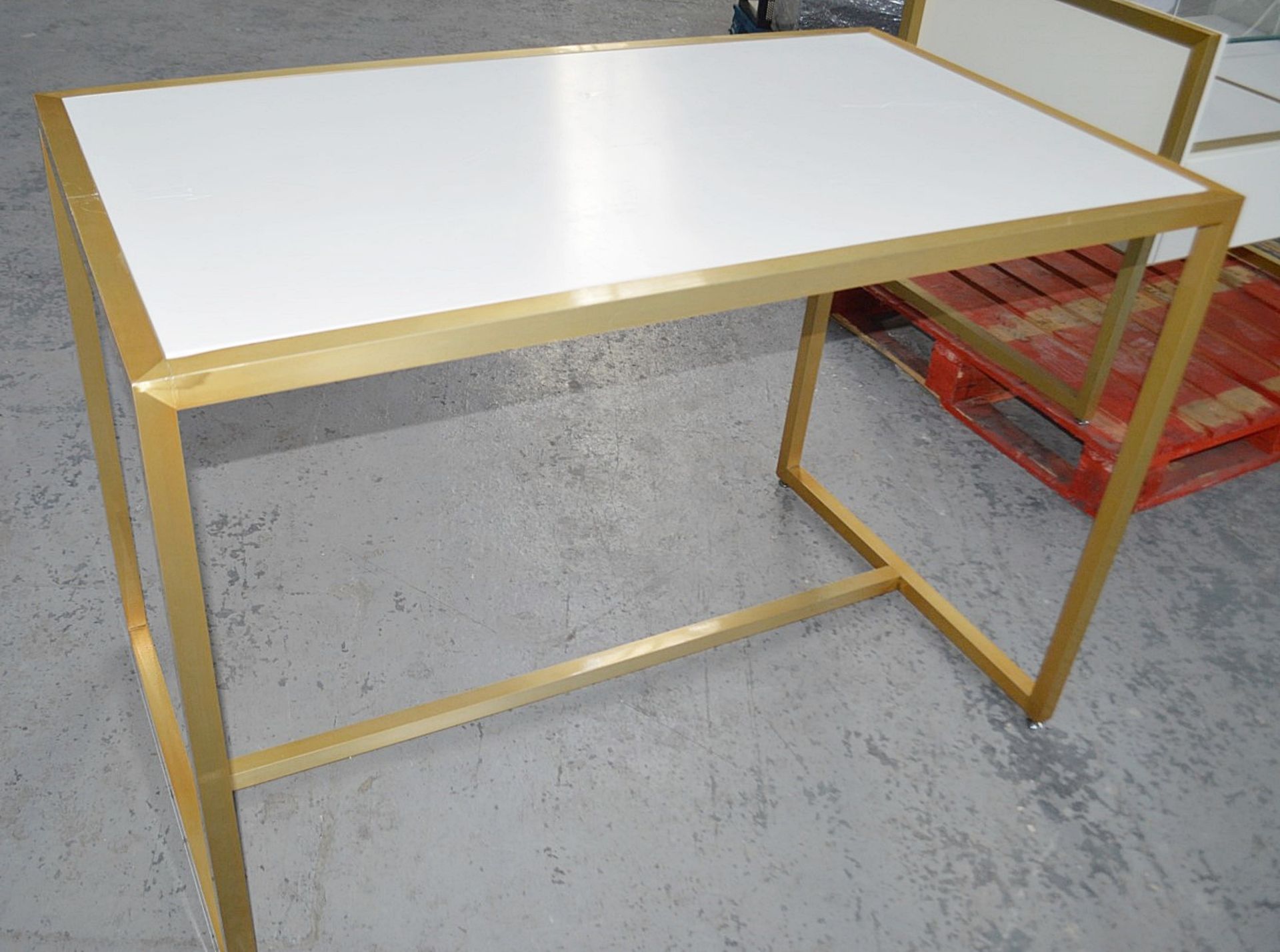 1 x High Display Table With A Sturdy Metal Base In Gold - Dimensions: H92 x W130 x D75cm - Image 2 of 4