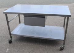 1 x Stainless Steel Mobile Kitchen Prep Table With Undershelf, Castor Wheels and Central Drawer -