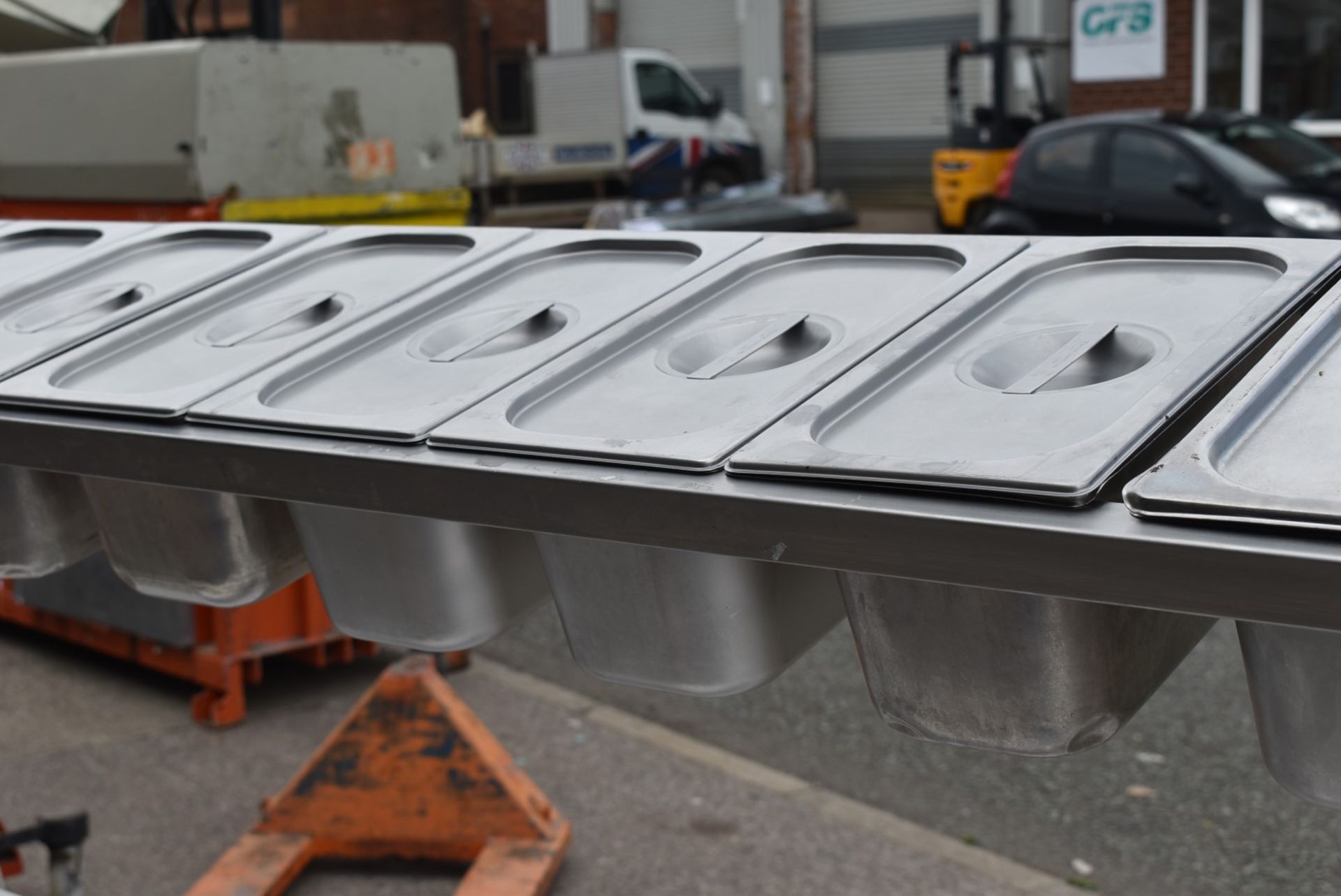 1 x Stainless Steel Mobile Prep Bench Featuring Overhead Pizza Topper Shelf With 9 Gastro Topper Pan - Image 11 of 17