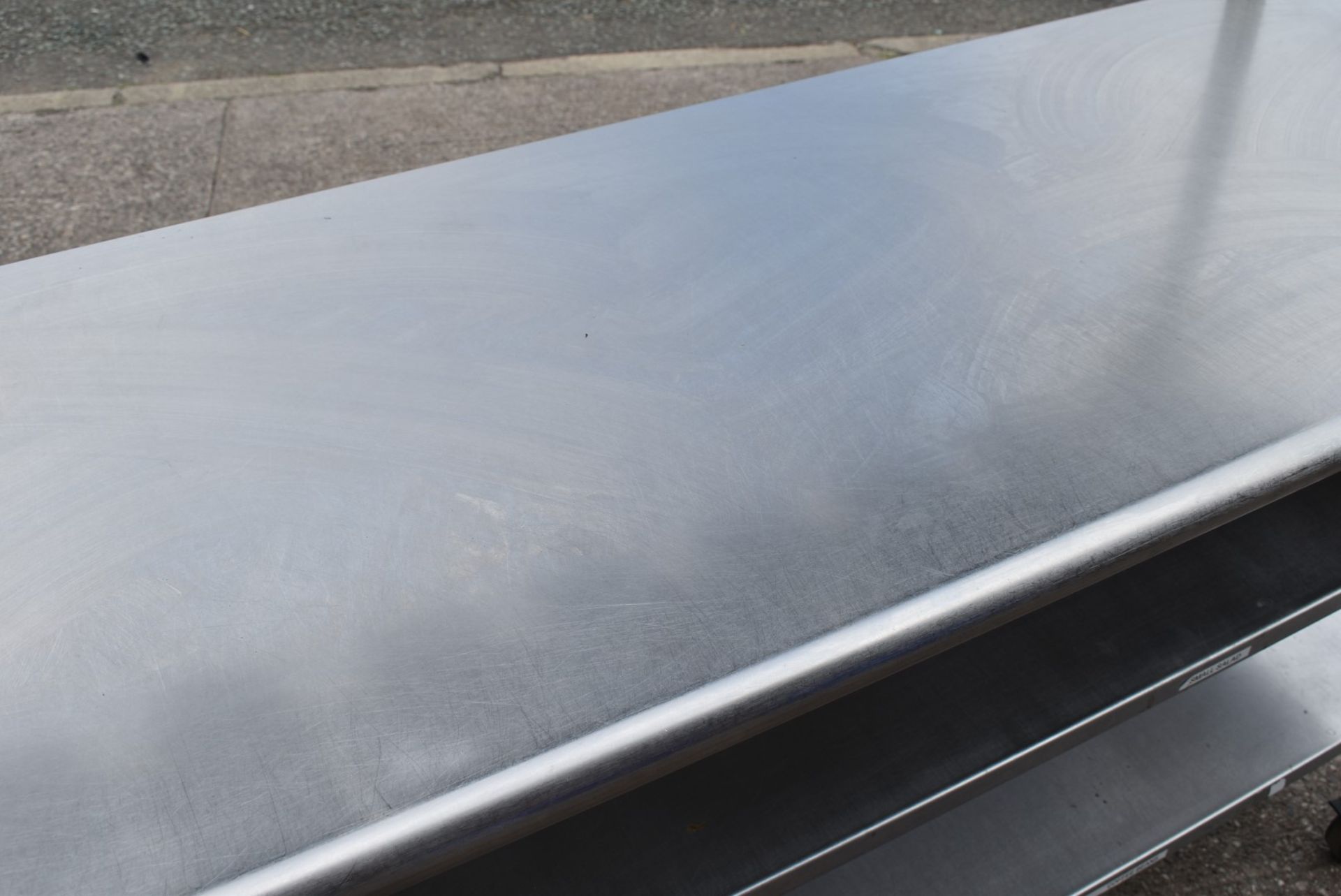 1 x Stainless Steel Mobile Prep Bench Featuring Overhead Pizza Topper Shelf With 9 Gastro Topper Pan - Image 13 of 17