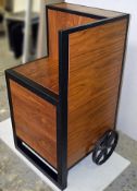 1 x Freestanding Display Unit Featuring Metal Cart Wheels And Wood Finish