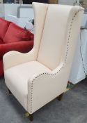 1 x Large Commercial Wing-Back Armchair In A Peach Leather With Studded Detailing - Professionally