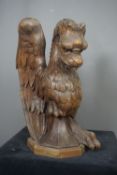 Tribal art image of winged dragon in wood H50