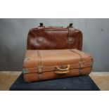 Couple of suitcases in leather and wood