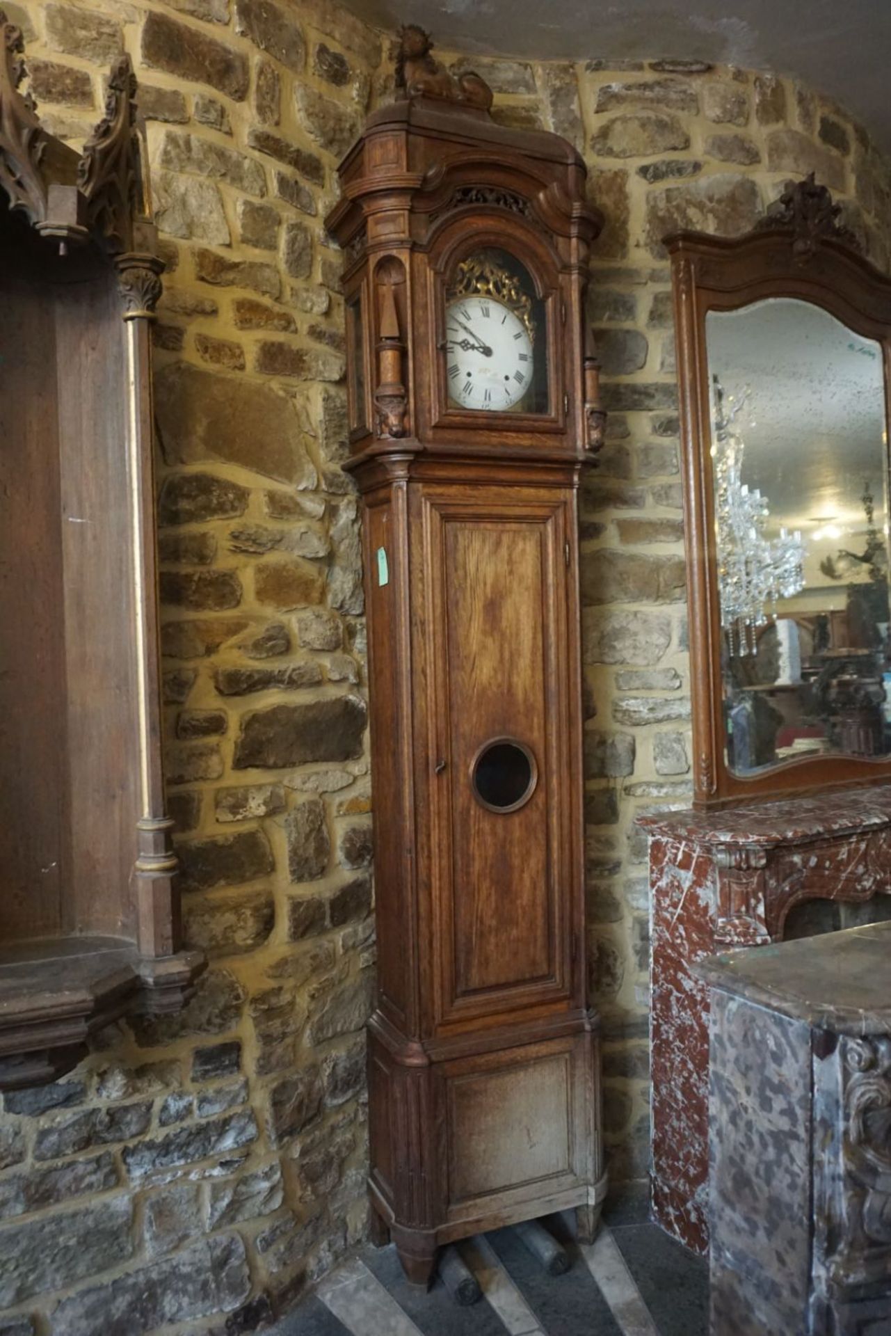 Unusual clock with the representation of a bull at the top. 19th H300x50