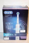 BOXED ORAL B POWERED BY BRAUN SMART 5 5000 TOOTHBRUSH RRP £85.00Condition ReportAppraisal