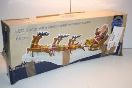 BOXED PREMIER LIT VILLAGE LED SANTA WITH SLEIGH AND REINDEER SCENECondition ReportAppraisal