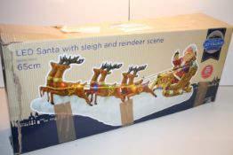 BOXED PREMIER LIT VILLAGE LED SANTA WITH SLEIGH AND REINDEER SCENECondition ReportAppraisal