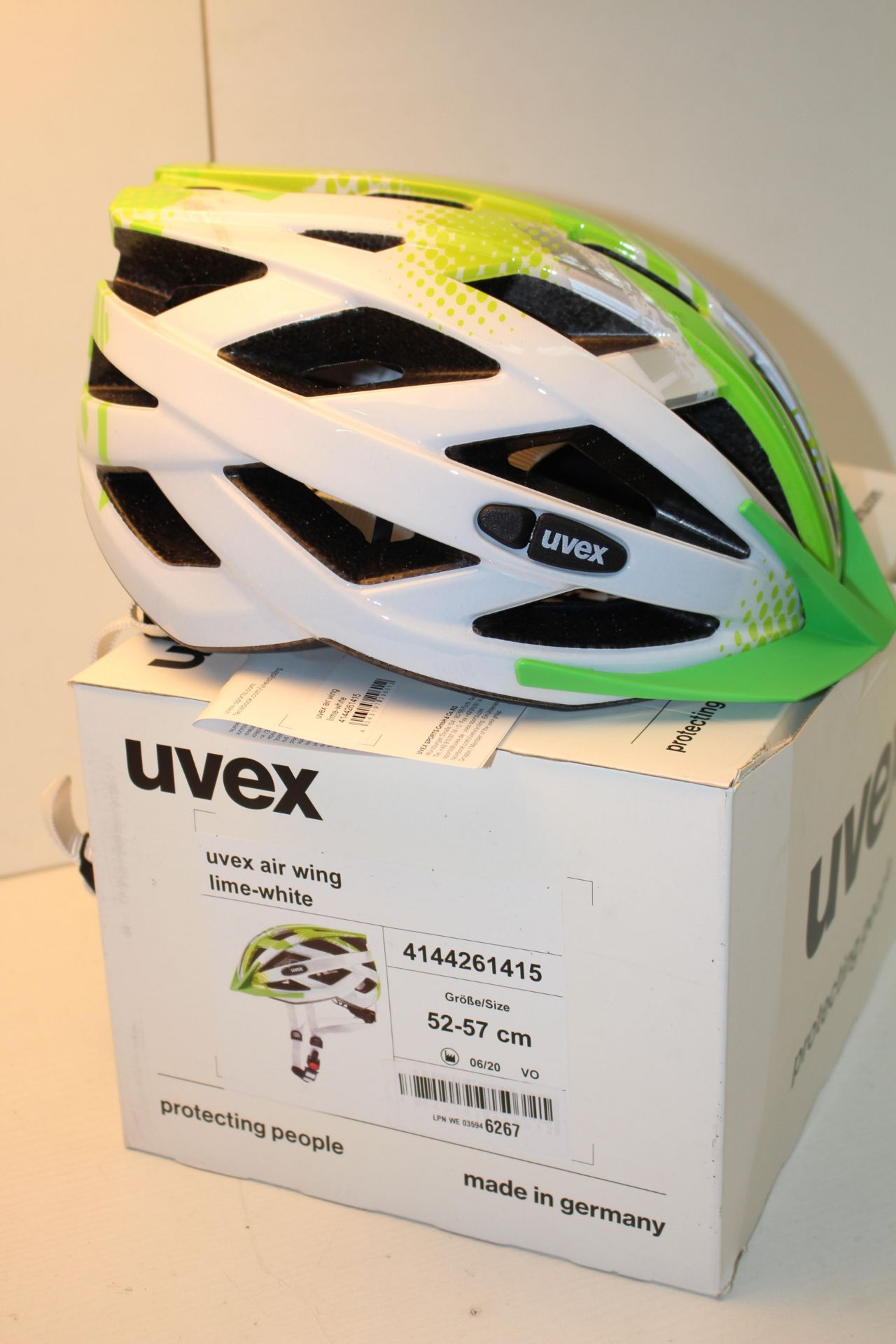 BOXED UVEX AIR WING LIME WHITE 52-57CM RRP £56.89Condition ReportAppraisal Available on Request- All