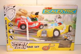 BOXED WARNER BROS MY FIRST SCALEXTRIC LOONEY TUNES RACE SET RRP £59.99Condition ReportAppraisal