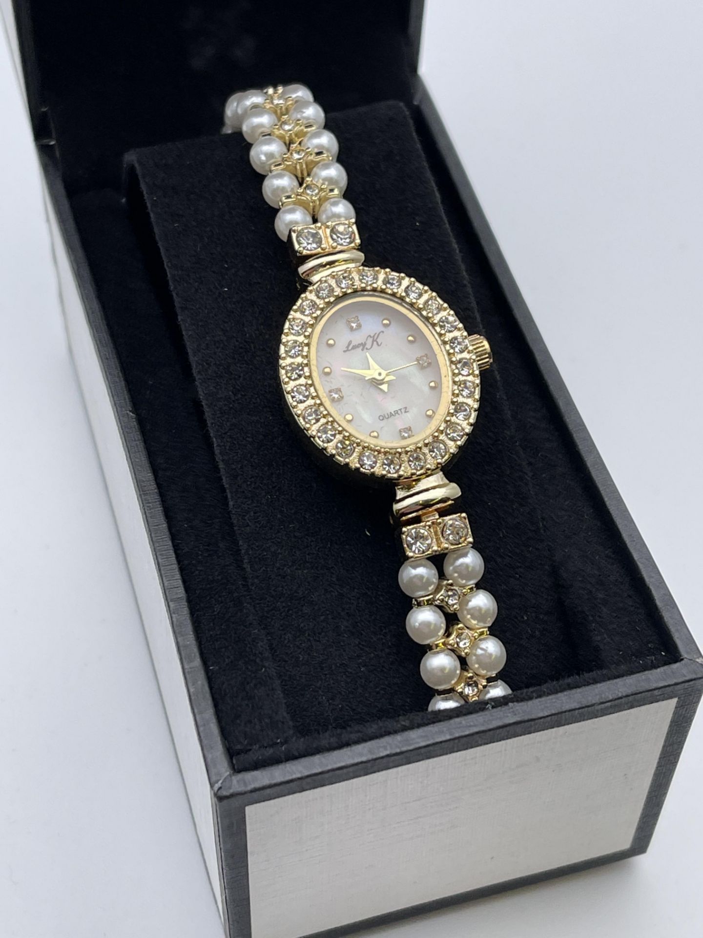 BOXED LUCY K LADIES DRESS WATCH, MOTHER OF PEARL EFFECT DIAL AND STRAP, APPEARS NEW, MAY NEED