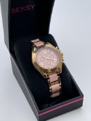 BOXED LADIES SEKSY WATCH, ROSE GOLD TONE WITH PINK CVERAMIC STRAP, MODEL- ETON EDITION, APPEARS