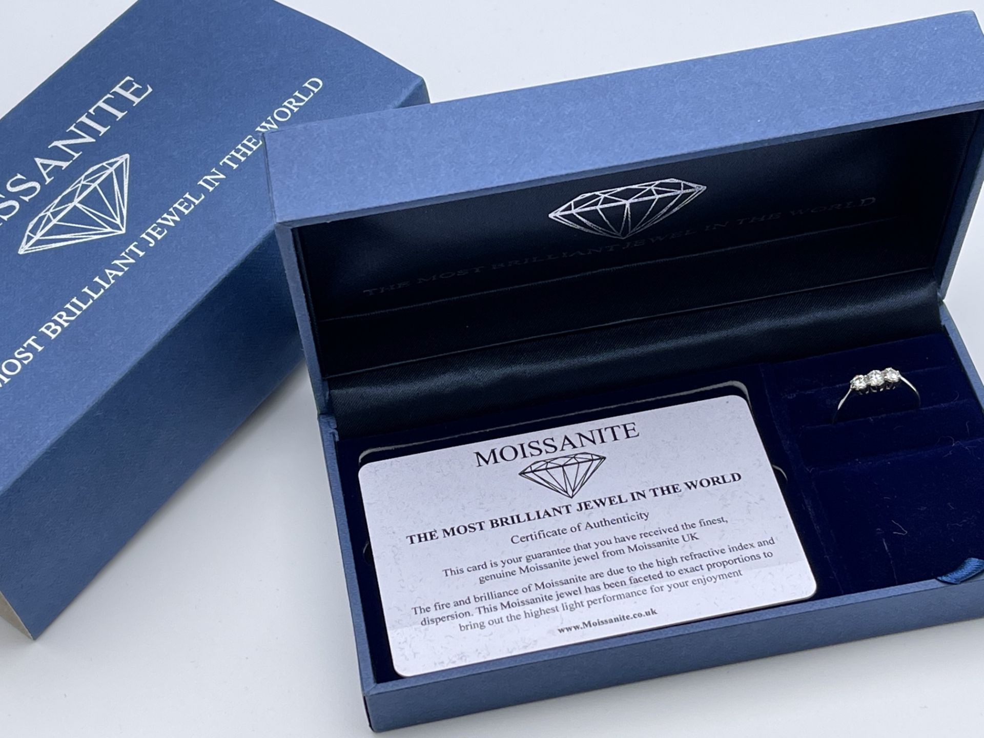 BOXED CHARLES AND COLVARD CREATED MOISSANITE THREE STONE RING, SET IN 9CT WHITE GOLD, EACH STONE - Image 2 of 3