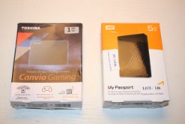 2X BOXED ITEMS TO INCLUDE WD 5TB MY PASSPORT & TOSHIBA CANVIO GAMING 1TB COMBINED RRP £140.