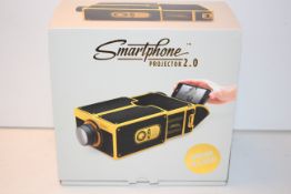 BOXED SMART PHONE PROJECTOR 2.0 CINEMA IN A BOX LUCKIES RRP £19.99Condition ReportAppraisal