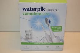 BOXED WATERPIK COMPLETE CARE SONIC 9.0 RRP £129.00Condition ReportAppraisal Available on Request-