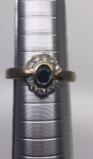 Diamond and sapphire Ring Size O 3.7g 9 ct yellow gold Oval sapphire approx 0.6ct Set with 10