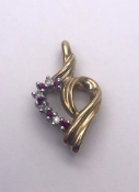 9 carat Yellow Gold Heart Pendant set with 4 Round Cut Diamonds and 5 Round Cut Rubies 1.3g Ref 425