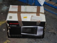 BOXED SHARP YC-MG02 MICROWAVE OVEN WITH GRILL RRP £84.99Condition ReportAppraisal Available on