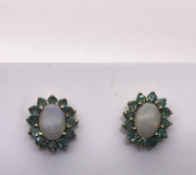 Opal and Emerald earrings set in Yellow Gold