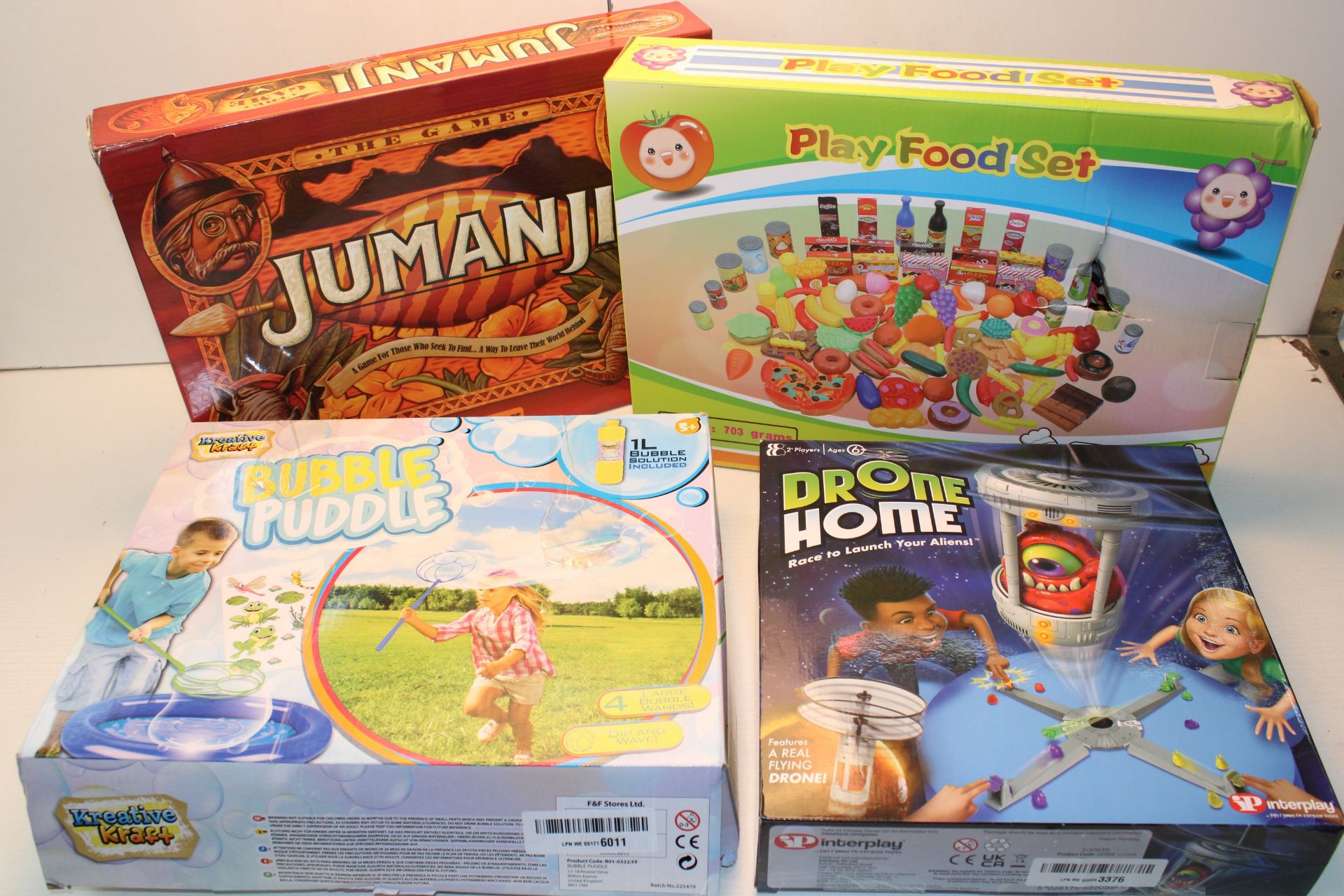 X 4 BOXED GAMES TO INCLUDE DRONE HOME, JUMANJI, BUBBLES, PLAY FOOD SET Condition ReportAppraisal