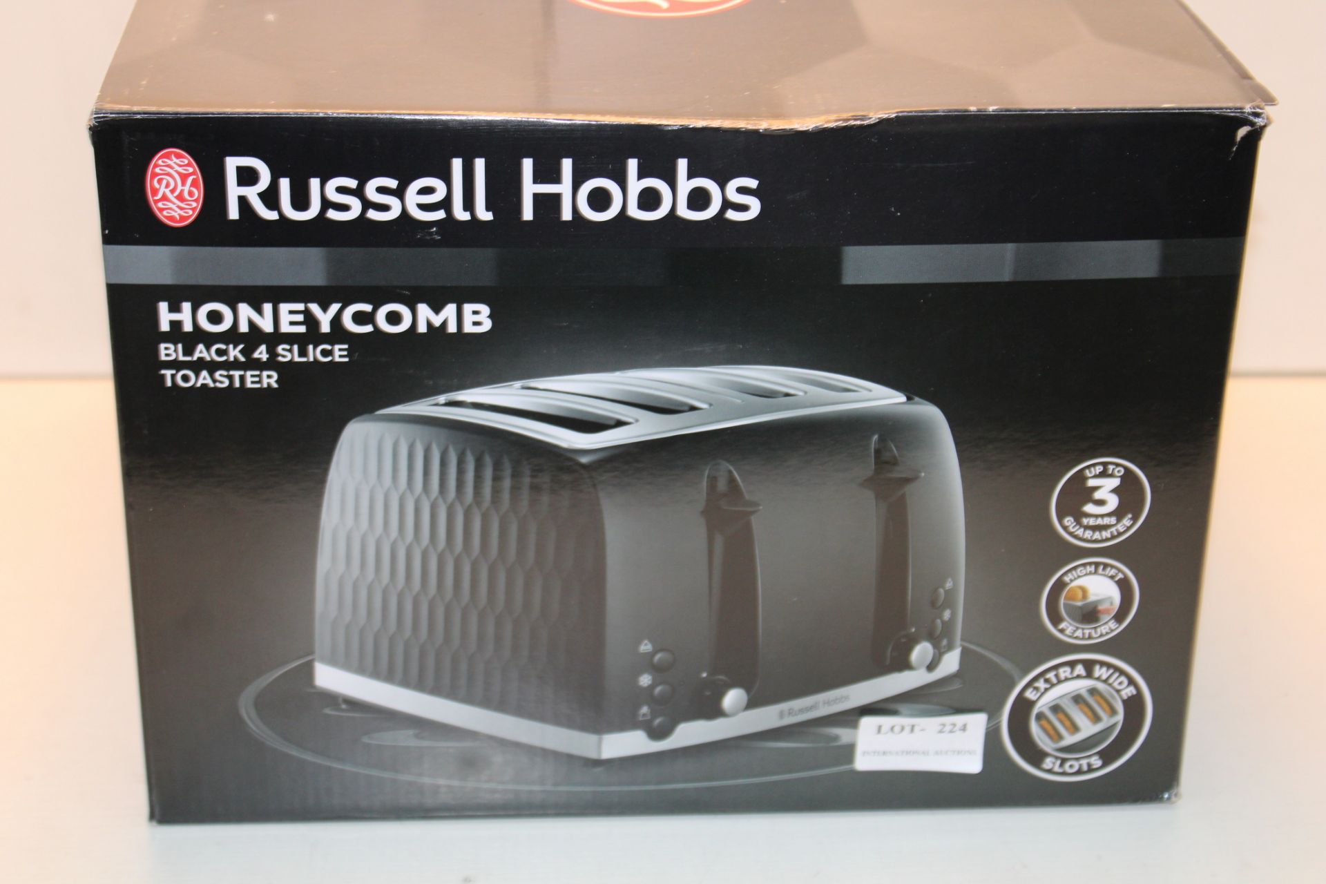 BOXED RUSSELL HOBBS HONECOMB BLACK4 SLICE TOASTER RRP £35.99Condition ReportAppraisal Available on