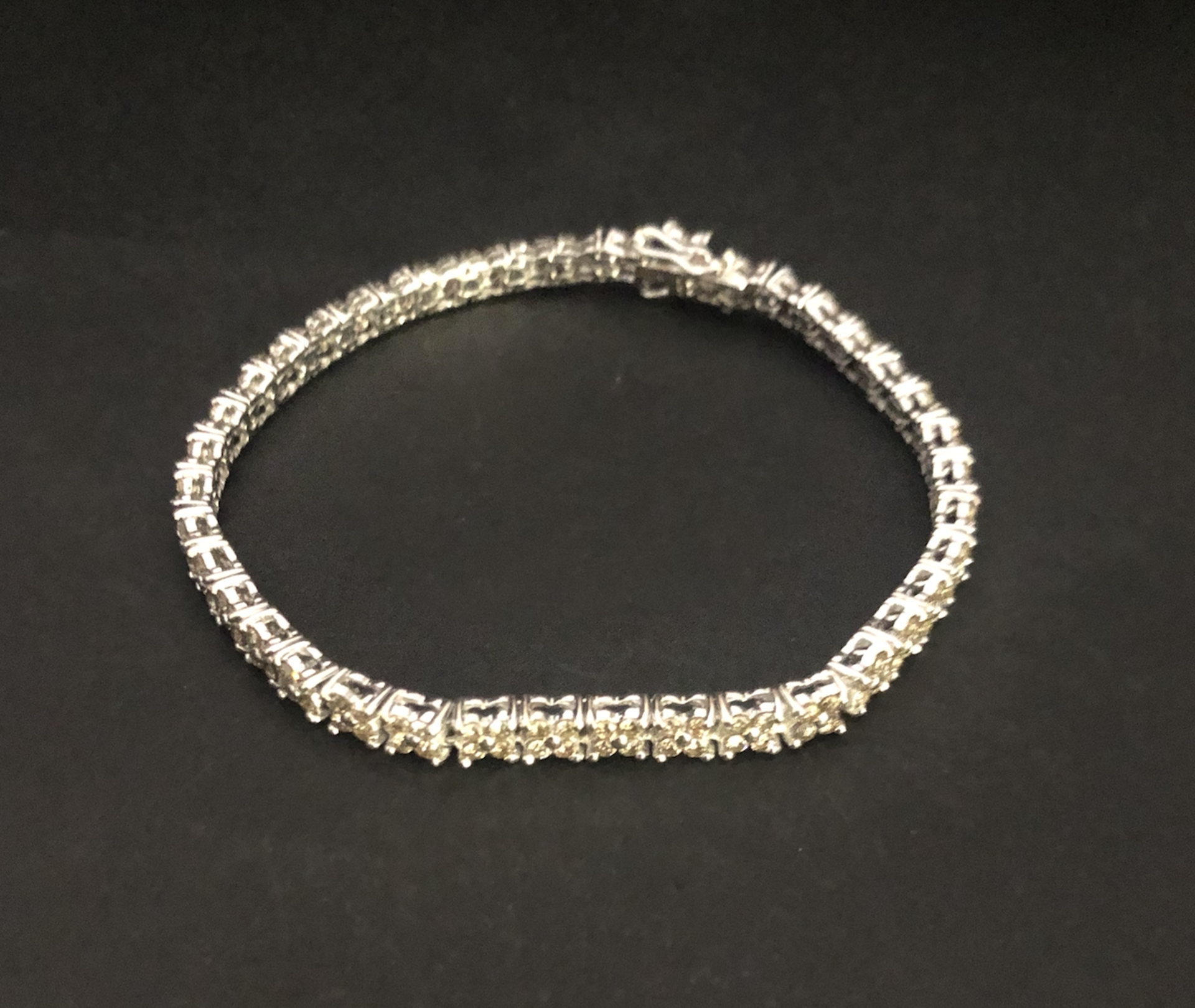 18 carat White Gold, 5 carat Flower set Diamond Line Bracelet