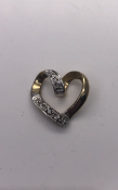 9ct yellow gold heart shaped diamond pendant set with 5 round diamonds 0.8g