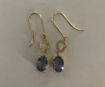 Drop Earrings 2 x 1 carat Oval shaped Sapphires with approx. 0.2 Pave set diamonds