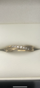 9 carat yellow gold diamond twist ring Set with 7 diamonds Size O