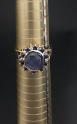 Vintage Star Sapphire Cabochen ring, set in 18 carat Yellow Gold surrounded by smaller Sapphires and