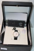 BOXED ORNAKE DESIGNER MENS WRIST WATCH & BLACK LEATHER STRAP WITH HIGH GLOSS BLACK WOODEN CASE