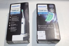 2X BOXED PHILIPS SONICARE 2100 DAILY CLEAN SONIC TOOTHBRUSH COMBINED RRP £60.00Condition Report