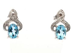 9ct White Gold Diamond And Blue Topaz Earring 0.02 Carats - Valued by GIE £950.00 - A beautiful oval