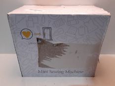 RRP £3.50 Beginner's Mini Sewing Machine with Extension Table;Easy-Sew Sleeves