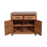 A MONTANA 2 DOOR SIDEBOARD - NIBBED OAK 106cm x 56cm x 94cm (rrp £845)