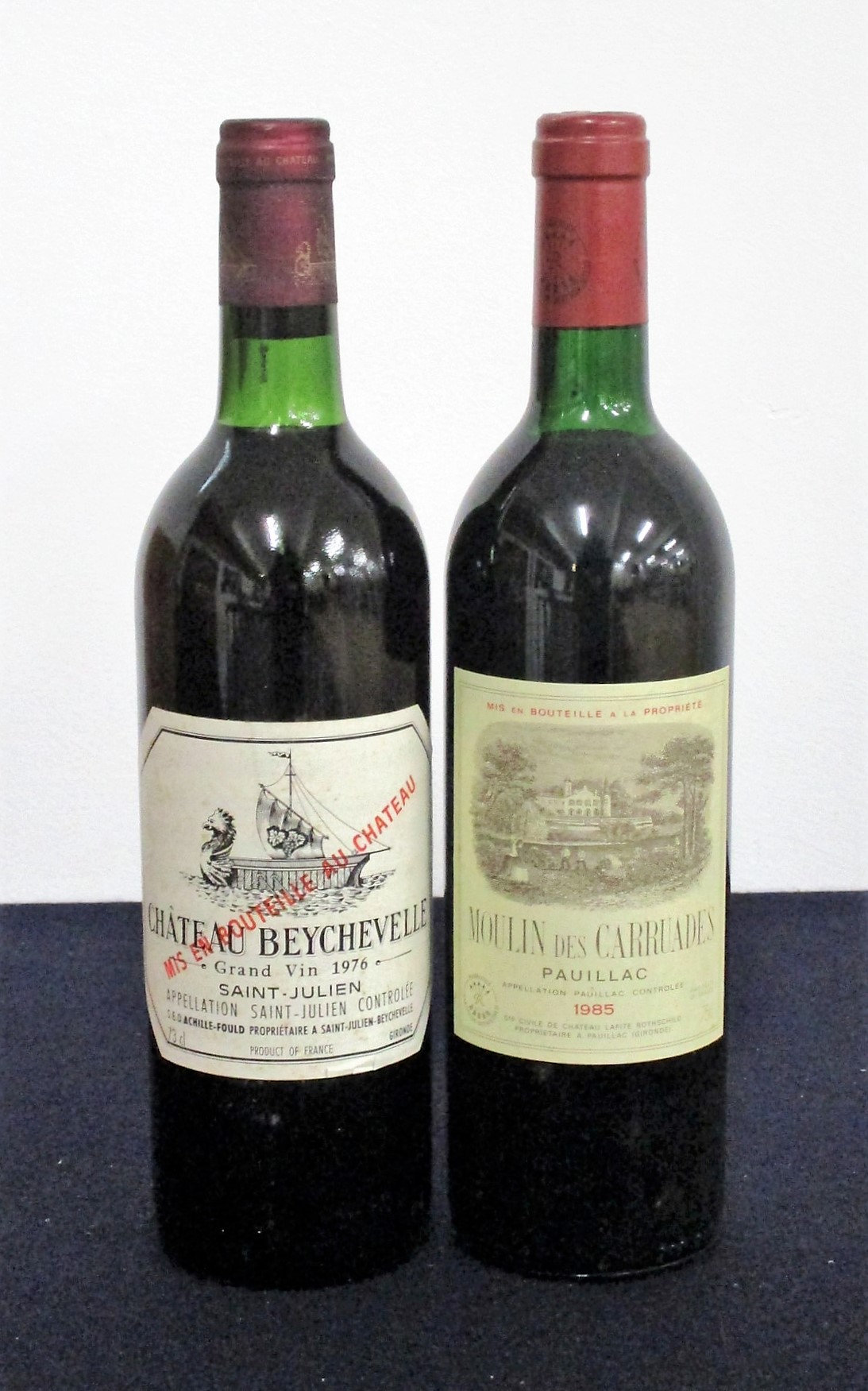 1 bt Ch. Beychevelle 1976 St-Julien ts, sl aged label 1 bt Moulin des Carruades 1985 Pauillac us/