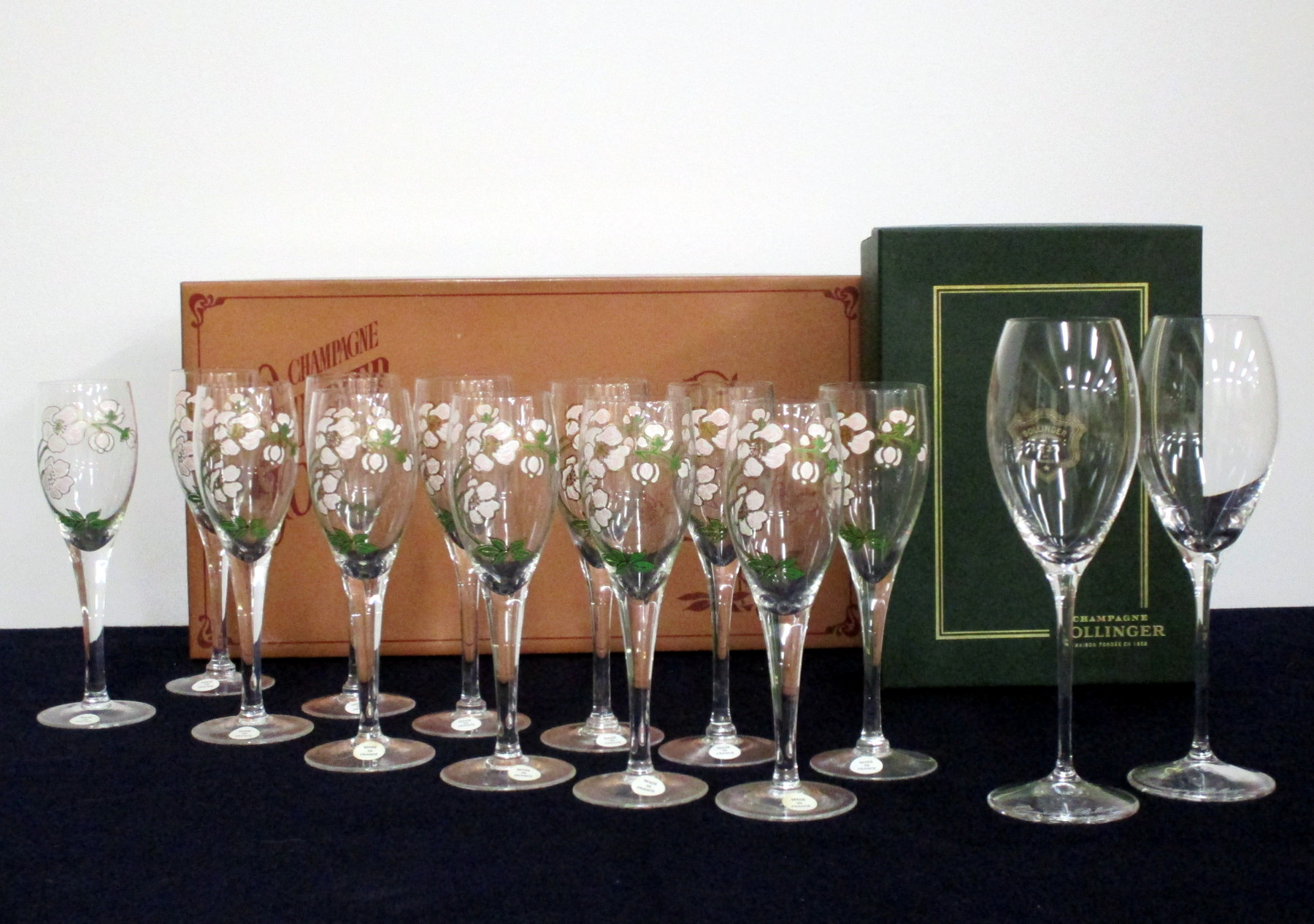 12 Perrier Jouêt Belle Epoque Champagne Flutes and 2 cased Bollinger Champagne Flutes, Riedel